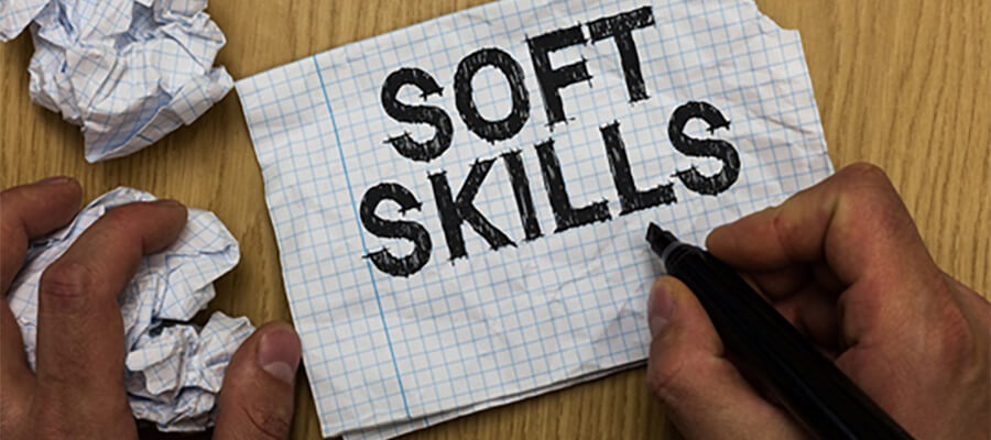 'Soft Skills' hand written on a piece of squared paper.